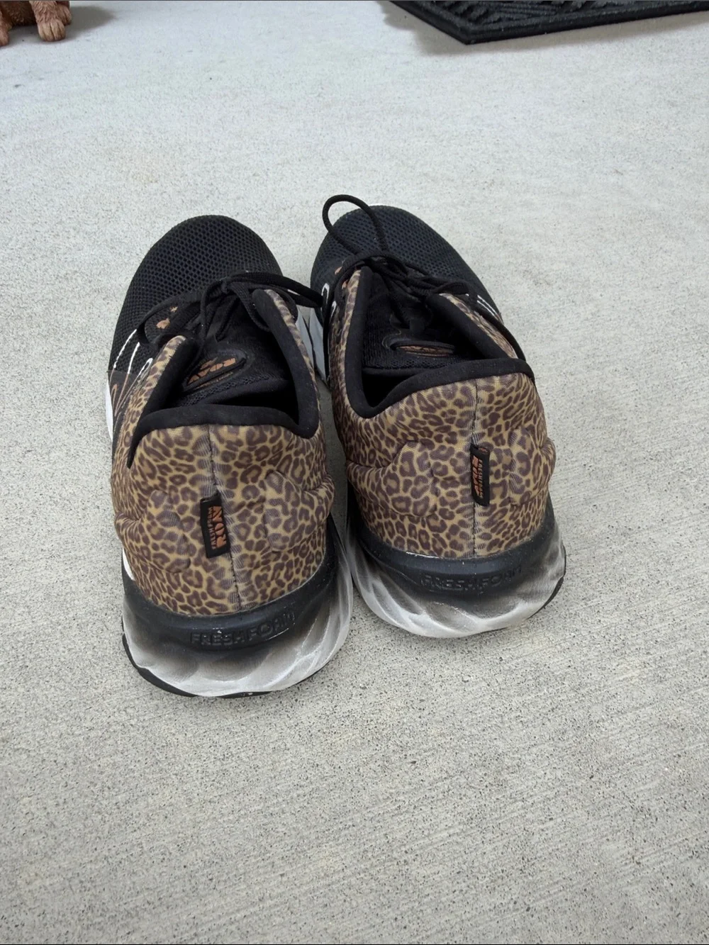 New Balance Black Athletic Sneakers with Leopard Print Accents